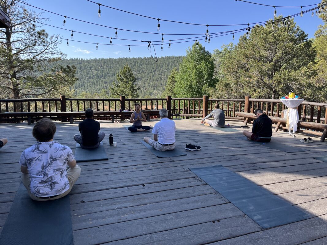Morning yoga on the deck at Valiant Living